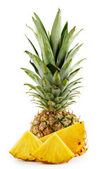 Pineapple with leaves and cut into slices