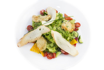 salad of meat cheese and vegetables in a restaurant