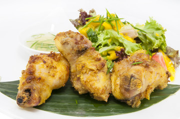 chicken in curry with salad and sauce