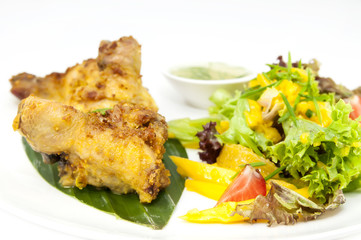 chicken in curry with salad and sauce