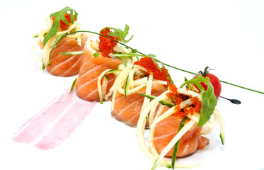 meat rolls with salmon and cucumber decorated with caviar