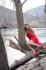 Woman in a red dress like a little red riding hood