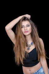 Fototapeta premium Woman with green eye contact lens , long hair and big necklace