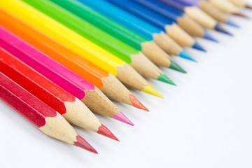 Colored pencils on white background