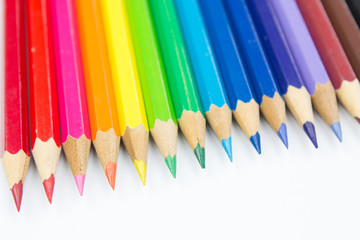 Colored pencils on white background