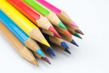 Colored pencils on white background