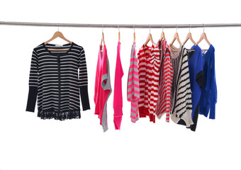 female different colors striped Shirts clothing hanging on hangers