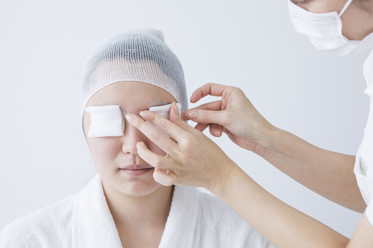Woman wearing a gauze to eye