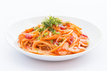 The spaghetti on a white plate.