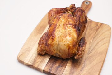 Oven roasted hot chicken on a white background.