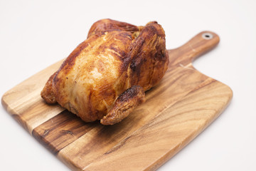 Oven roasted hot chicken on a white background.