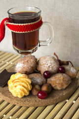 hot tea in a glass with cookies and chocolate