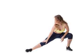 Pretty girl doing stretching, isolated on white