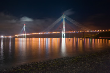 Fototapeta na wymiar Night view of the bridge on the Russian island. Vladivostok.