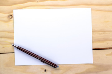 pen over white paper page
