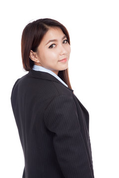 Young Asian businesswoman turn back look at camera