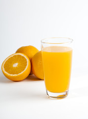 Sliced orange and a glass of orange juice