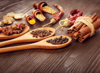 Herbs and Spices over wooden background