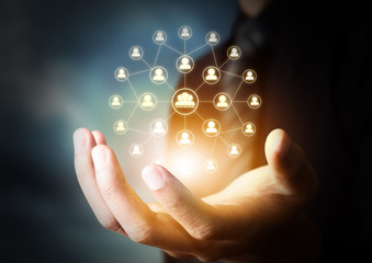 Business hand holding virtual icon of social network