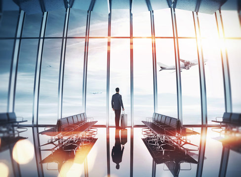 Businessman At Airport Near The Window