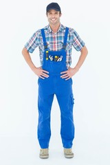 Portrait of confident plumber with hands on hip