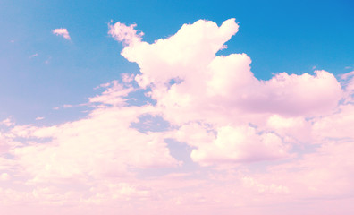 Blue sky background with pink clouds