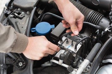 Man checking the engine of his car