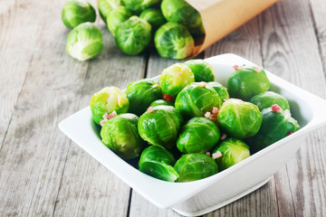 Fresh Brussels Sprouts on White Bowl on the Table