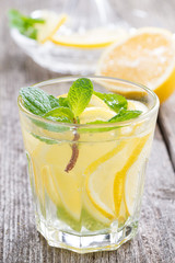 refreshing mint lemonade on a wooden table, close-up