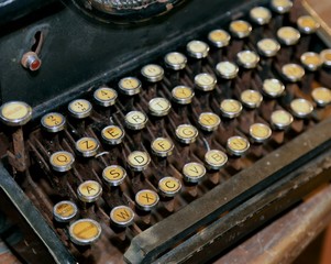 retro black rusty typewriter with white keys