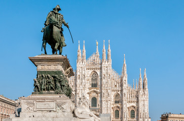 Fototapeta na wymiar Milan Cathedral Dome facade with statue of Vittorio Emanuele II