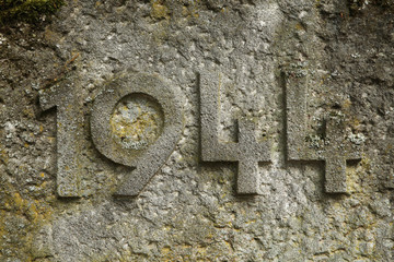 Year 1944 carved in the stone. The years of World War II. - obrazy, fototapety, plakaty