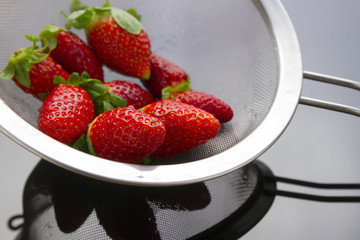 strawberries in strainer