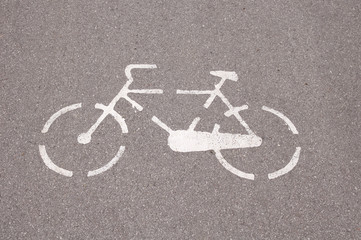 Obraz na płótnie Canvas Painted sign white bicycle closeup