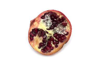 Cut half of the fruit - pomegranates. Photo.