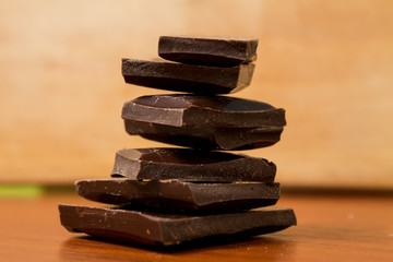 A handful of dark chocolate on a table