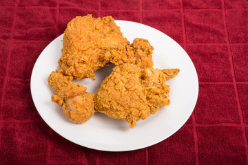Fried Chicken on White Plate and Red Towel