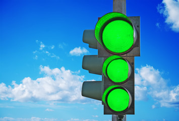 traffic light with three green lights on