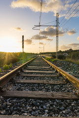 Fototapeta na wymiar Railway at sunset. Low angle view
