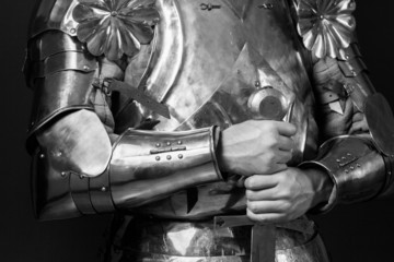 knight wearing armor and holding two-handed sword