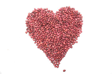 Heart of red beans on a white background. Photo.