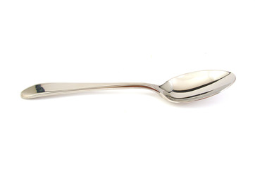 Metal spoon on white background.