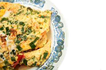 Vegetable omelet with eggs on a plate. Photo.