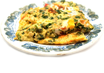Vegetable omelet with eggs on a plate. Photo.
