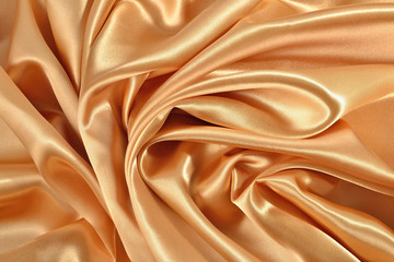 Background from golden satin fabric