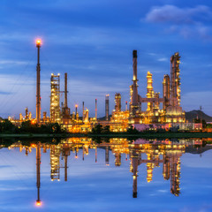 Oil refinery at twilight - petrochemical industry with water ref
