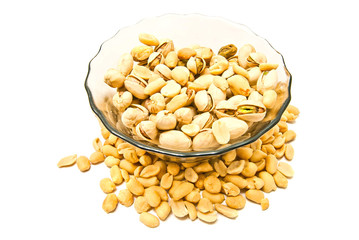 dish with pistachios and peanuts closeup