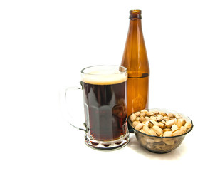 dark beer and pistachios on white