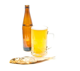 glass of light beer and stockfish on white
