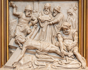 Fototapeta na wymiar Vienna - Jesus is nailed to the cross relief in Sacre Coeur